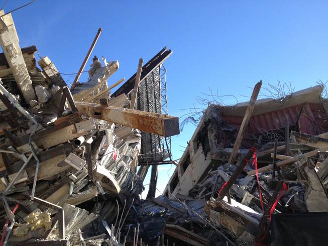 Rubble from the Gramercy's nine-story residential tower sits Sunday, Feb. 15, 2015, about an hour after the southwest Las Vegas building was imploded.