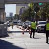 Police direct traffic as they reopen the northbound lanes of Las Vegas Boulevard after an accident near Flamingo Road Tuesday, Feb. 17, 2015. Six vehicles were involved, including a stolen pickup truck and an RTC bus.