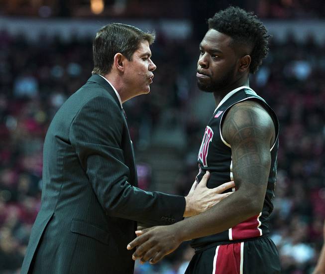 UNLV basketball team head coach Dave Rice attempts to reach UNLV guard Jordan Cornish (3) who is angered by a foul call versus Boise State on Wednesday, February, 18. 2015. L.E. Baskow