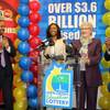This undated photo shows Powerball jackpot winner Marie Holmes, second from left, after she received a check from North Carolina Education Lottery executive director Alice Garland, second from right, in Raleigh, N.C. To the left is financial adviser Dexter Perry and attorney Charles Francis, right. Holmes, a single mother of four, came forward Monday, Feb. 23, 2015, as one of three winners in a huge Powerball jackpot.