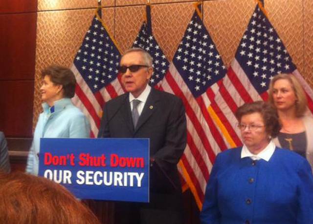 Harry Reid, who injured his eye earlier this year, wears a pair of sunglasses during a press event on Tuesday, Feb. 24, 2015.