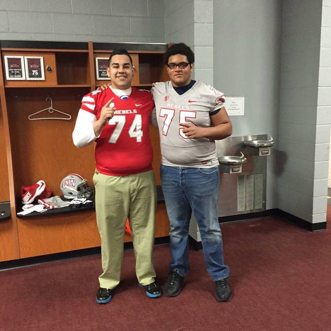 Bishop Gorman High linemen Julio Garcia II and Jaron Caldwell take a photo in UNLV jerseys during an unofficial visit to campus Feb. 28, 2015. Both 2016 prospects committed.