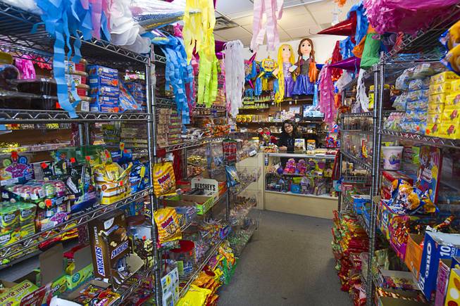 Owner Christy Delcid is shown behind the counter in Christy's Candy Shop at the Boulevard Mall Sunday, March 1, 2015.
