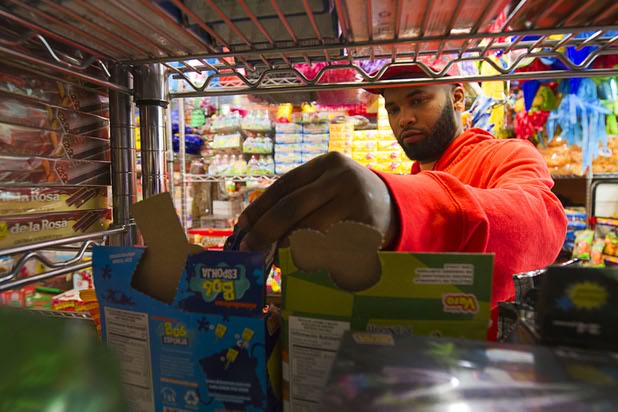 Quel Craig of Trenton, N.J. checks out candy in Christy's Candy Shop at the Boulevard Mall Sunday, March 1, 2015.