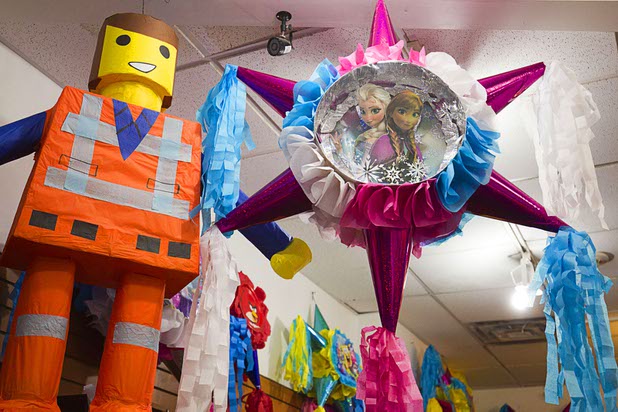 Pinatas hang from the ceiling in Christy's Candy Shop at the Boulevard Mall Sunday, March 1, 2015.