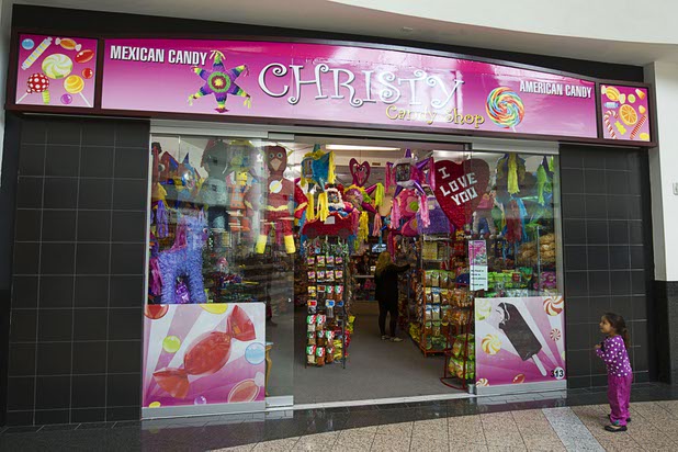 A girl stands by the entrance to Christy's Candy Shop in the Boulevard Mall Sunday, March 1, 2015.