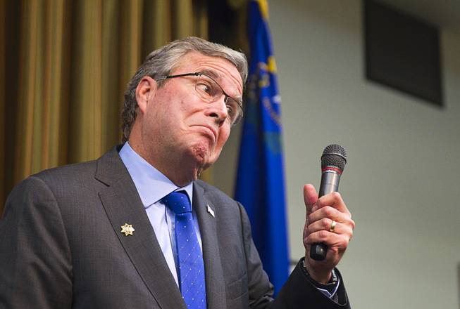 Former Florida Gov. Jeb Bush reacts to a question at the Mountain Shadows Community Center in Las Vegas Monday, March 2, 2015.