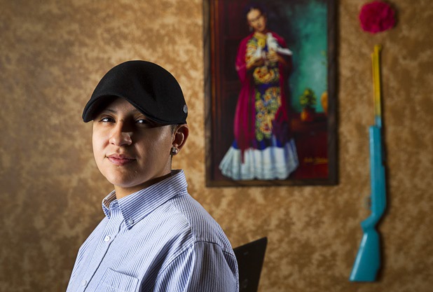 Army veteran Cristina Alfonso-Zea, 29, poses at her home Tuesday, March 3, 2015. Now employed in IT with a casino company, she previously served in Iraq and Afghanistan.