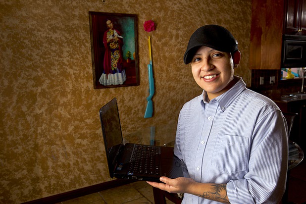 Army veteran Cristina Alfonso-Zea, 29, poses at her home Tuesday, March 3, 2015. Now employed in IT with a casino company, she previously served in Iraq and Afghanistan.