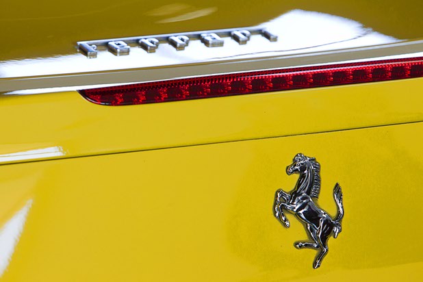 The Ferrari emblem is shown on a 2010 Ferrari 458 Italia at Celebrity Cars Las Vegas Wednesday, March 4, 2015. The company recently moved from a showroom at the Palazzo to a new 20,000 sq. ft. showroom at 7770 Dean Martin Drive.