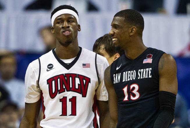 UNLV forward Goodluck Okonoboh (11) makes a face after another foul call which humors Sand Diego State forward Winston Shepherd (13) during their game at the Thomas & Mack Center in Las Vegas on Wednesday, March, 4, 2015.