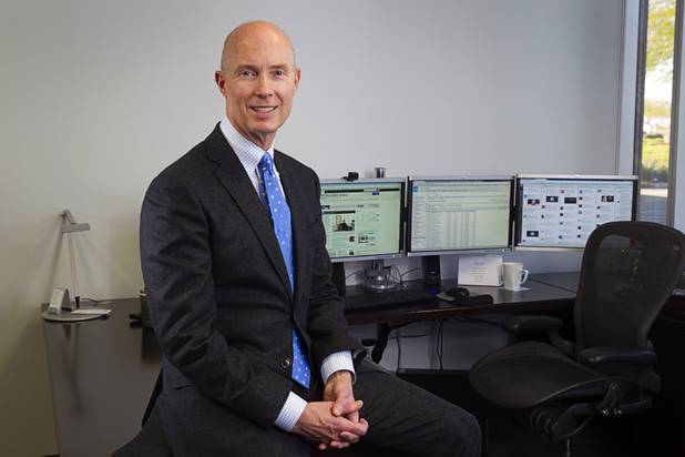 Mike PeQueen, managing director/partner of HighTower Las Vegas, poses in his office in Henderson Monday, March 9, 2015. 