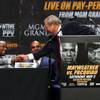 Top Rank CEO Bob Arum shakes hands with boxer Floyd Mayweather Jr. during a news conference at Nokia Theater on Wednesday, March 11, 2015, in Los Angeles. Mayweather and Manny Pacquiao are scheduled to fight May 2 in Las Vegas. 