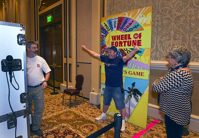 Andy Vanhorne has his photo taken during Wheel of Fortune ...