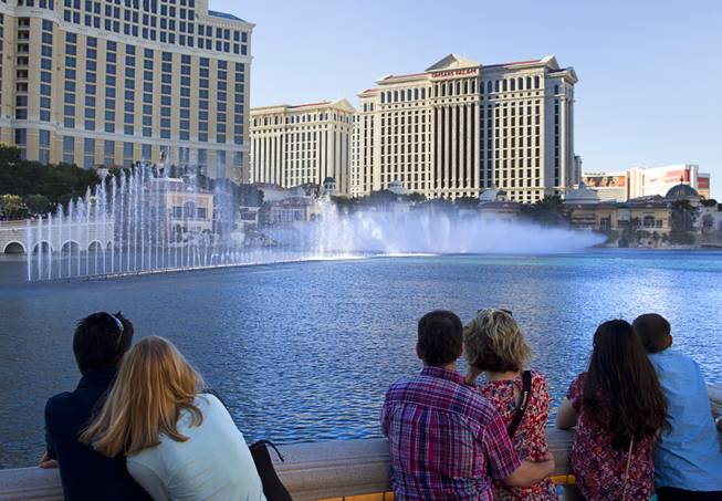 Couples watch the show at Bellagio Fountains on Monday, March 16, 2015, on the Las Vegas Strip.