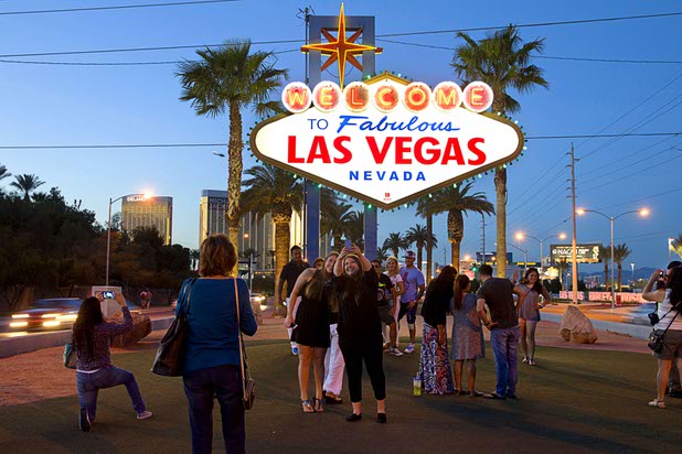 Tourists take photos at the Welcome to Fabulous Las Vegas sign Saturday, March 14, 2015, on the Strip.