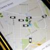 In this Wednesday, March 18, 2015, photo, the Uber app displays on a smartphone vehicles available for a pickup in downtown Manhattan.
