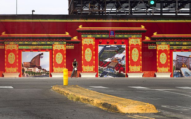 A woman stands in front of decorated fencing around the unfinished Echelon casino project on Las Vegas Boulevard Sunday, March 22, 2015. The Maylasia-based Genting Group bought the site and announced plans for Resorts World Las Vegas in March 2013.