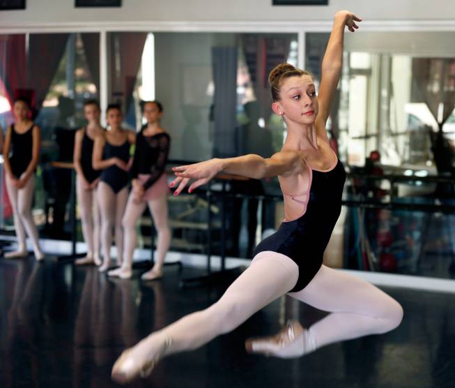 Ballerina Monika Haczkiewicz, 17, leaps while in dance class inside the Keith Kleven Institute on Wednesday, March, 4, 2015. She's going to New York City in April with instructor Tara Foy to compete for a chance to attend a prestigious dance school or join a ballet company.