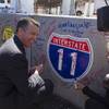 Gov. Brian Sandoval and Tina Quigley, Regional Transportation Commission general manager, sign a box culvert that will be used in the Interstate-11/Boulder City Bypass project during a groundbreaking ceremony Monday, April 6, 2015, near Boulder City.