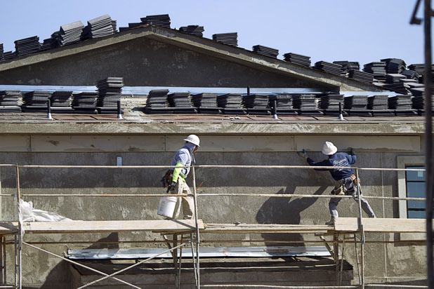Today, 48,500 people work in construction locally, up 39 percent from the depths of the Great Recession. In this photo, carpenters work on an apartment complex under construction Tuesday, April 7, 2015, at Hualapai and Peace Ways.