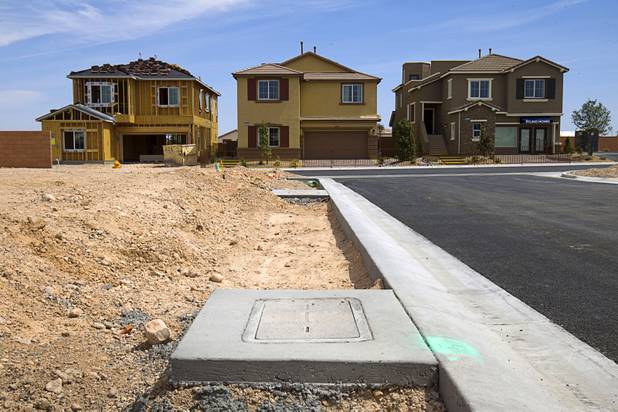 A view of model homes in a Ryland Homes subdivision at Buffalo and Diablo drives in the southwest valley Sunday, April 5, 2015.