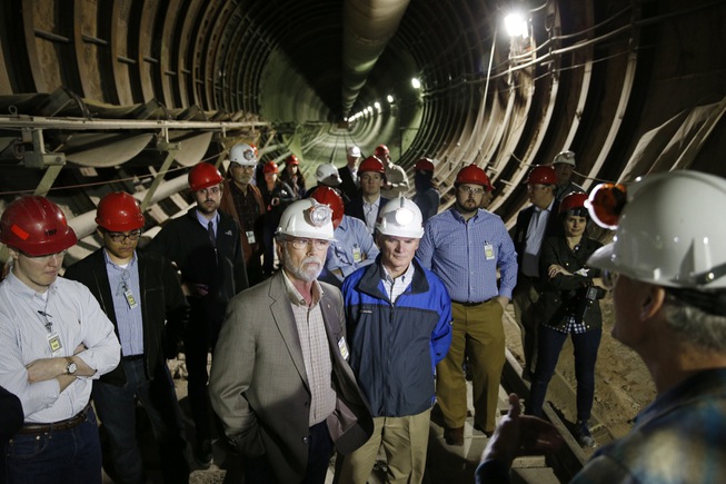 People stand inside of Yucca Mountain during a congressional tour ...