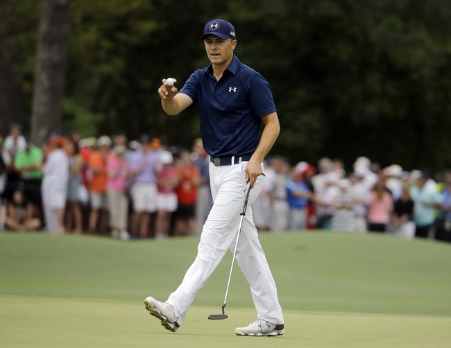 Jordan Spieth holds up his ball after a birdie on the eighth hole during the final round of the Masters golf tournament Sunday, April 12, 2015, in Augusta, Ga. With eight holes to play — including two par-5s — he already had a record 26 birdies for the week, eclipsing the 25 birdies that Phil Mickelson made at the 2001 Masters.