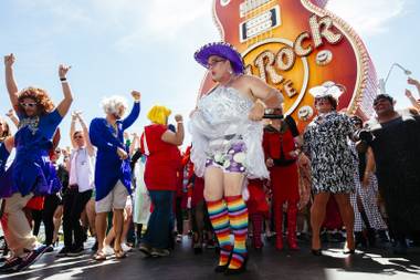 Drag queens dance during the Guinness World Records largest drag queen stage show performance at the Hard Rock Cafe in Las Vegas on Sunday, April 12, 2015.