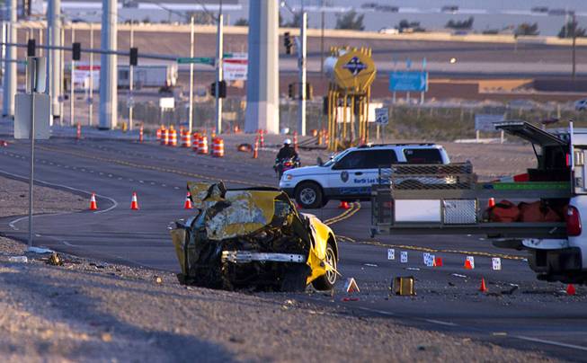 A vehicle is shown at the site of a fatal accident on Lamb Boulevard south of I-215 on Wednesday, April 15, 2015.  