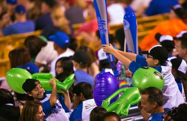 The Las Vegas 51s fans end the game with an alien battle in the stands at their home opener versus Fresno Grizzles at Cashman Field on Friday, April 17,&nbsp;2015.