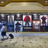 People pass by a display of Floyd Mayweather Jr. memorabilia Monday, April 20, 2015, in the lobby of MGM Grand.  
