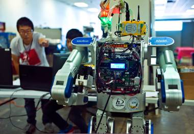 Dr. Kiwon Sohn and others take the Metal Rebel robot  through its paces in the newly built UNLV lab for its drone and robotics programs on Thursday, April 23, 2015.