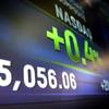 Market data is displayed on the screens at the Nasdaq MarketSite in New York, Thursday, April 23, 2015. The Nasdaq composite closed at a record high for the first time since the dot-com bubble of 2000.
