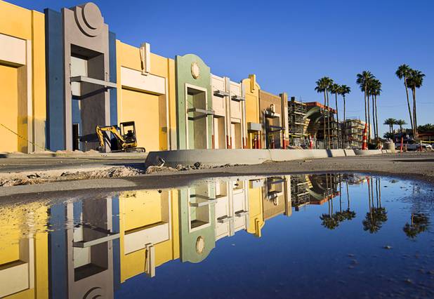 The renovated exterior of the Boulevard Mall is reflected in a puddle Tuesday, April 28, 2015. The mall, built in 1965, was sold to Sansone Companies in late 2013.