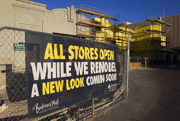 A sign lets shoppers know that stores are open during remodeling work on the exterior of the Boulevard Mall Tuesday, April 28, 2015. The mall, built in 1965, was sold to Sansone Companies in late 2013.