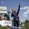 Michelle Balistreri and Chandler Gray attend a rally in front of NV Energy on Wednesday, April 22, 2015, in Las Vegas. Hundreds of activists gathered outside NV Energy headquarters in Las Vegas to protest a state cap affecting rooftop solar installations and urge the Legislature to lift it.