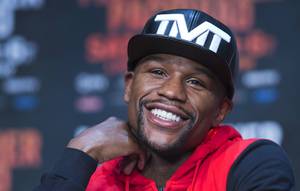 Undefeated WBC/WBA welterweight champion Floyd Mayweather Jr. of the U.S. smiles during a final news conference at the MGM Grand Wednesday, April 29, 2015. Mayweather will face WBO welterweight champion Manny Pacquiao of the Philippines in a welterweight unification bout at the MGM Grand Garden Arena Saturday.