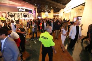 Security watches over the crowd as boxing fans exit the MGM Grand Garden Arena on Saturday, May 2, 2015.
