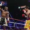 Floyd Mayweather Jr., left, celebrates during his welterweight title fight against Manny Pacquiao on Saturday, May 2, 2015 in Las Vegas.