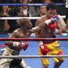 Floyd Mayweather connects to the chin of Manny Pacquiao late in their fight at the MGM Grand Garden Arena on Saturday, May 2, 2015