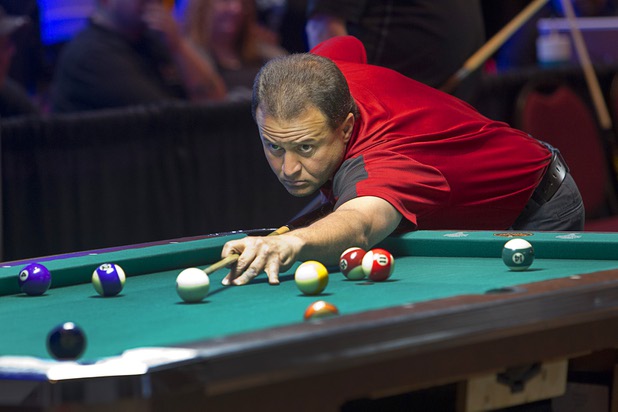 4:28 p.m. - Kenneth Geragosian of O'Fallon, Ill. competes in the semi-finals of the American Poolplayers Association (APA) tournament in the Riviera Sunday, May 3, 2015. Geragosian finished first in his division. The APA tournament has been coming to the Riviera for the past 23 years. STEVE MARCUS