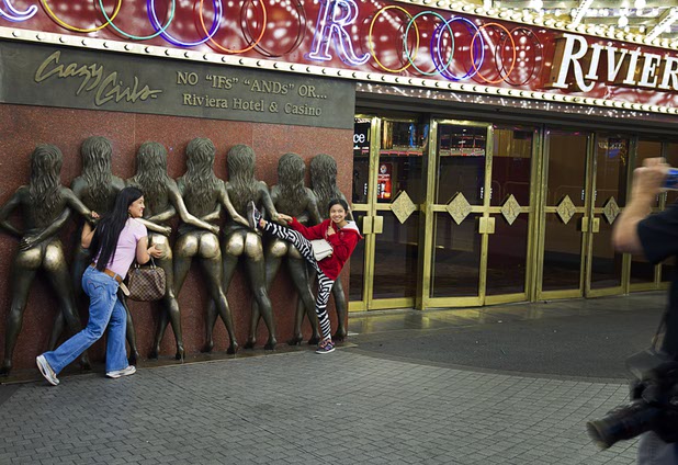 7:54 p.m. - May Alba and her daughter Kyla, 12, pose in front of the Crazy Girls sculpture at the Riviera Sunday, May 3, 2015.  STEVE MARCUS
