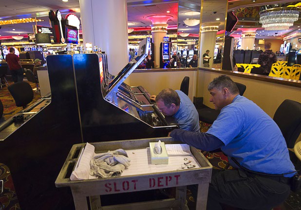 11:28 a.m. - Slot technicians work on video poker machines at the Riviera Monday, May 4, 2015. The Riviera slot and video poker machines were purchased by the D Las Vegas. STEVE MARCUS