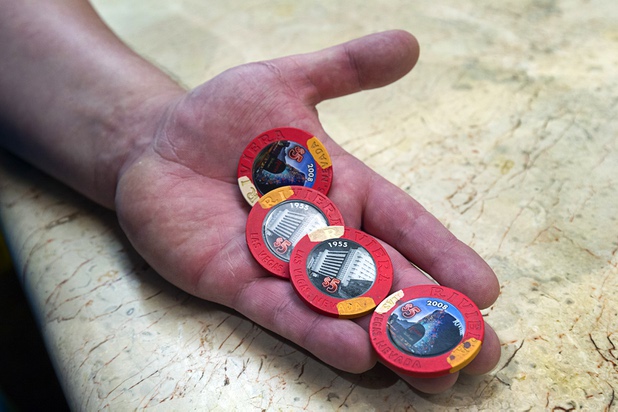 11:30 a.m. - A man shows off with casino chips purchased as a souvenir at the Riviera Monday, May 4, 2015.  STEVE MARCUS