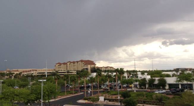 Rain clouds are seen over Green Valley Ranch Resort in Henderson, May 4, 2015.