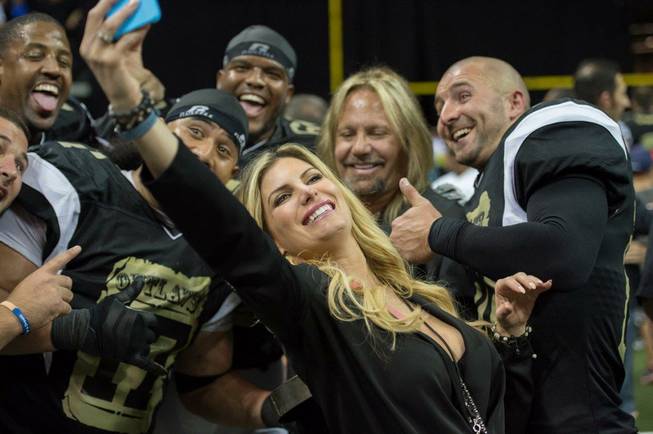 The Las Vegas Outlaws defeat the L.A. Kiss 49-16 on Monday, May 4, 2015, at the Thomas & Mack Center. Rain Hannah takes a selfie with boyfriend Vince Neil and Outlaws players.