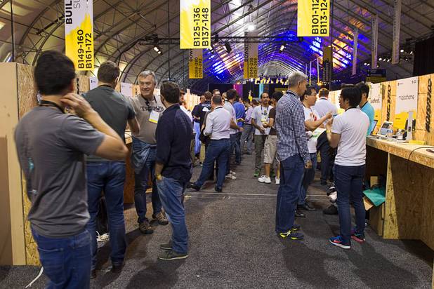 Entrepreneurs show of their products during the Collision technology conference at the World Market Center Pavilions Wednesday, May 6, 2015.