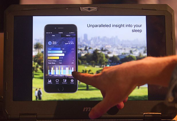 Timothy Antos of Kokoon Technology shows off a headphone App during the Collision technology conference at the World Market Center Pavilions Wednesday, May 6, 2015. The App monitors sleep patterns and sends the information to a smartphone in order to improve sleep over time.