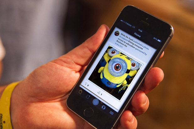 Mido De Santi of Pixhug shows one of his photos, taken at the Universal Studios gift shop, during the Collision technology conference at the World Market Center Pavilions Wednesday, May 6, 2015. The App partners with corporations that donate $1.00 to a selected charity when someone "likes" the photo on social media.